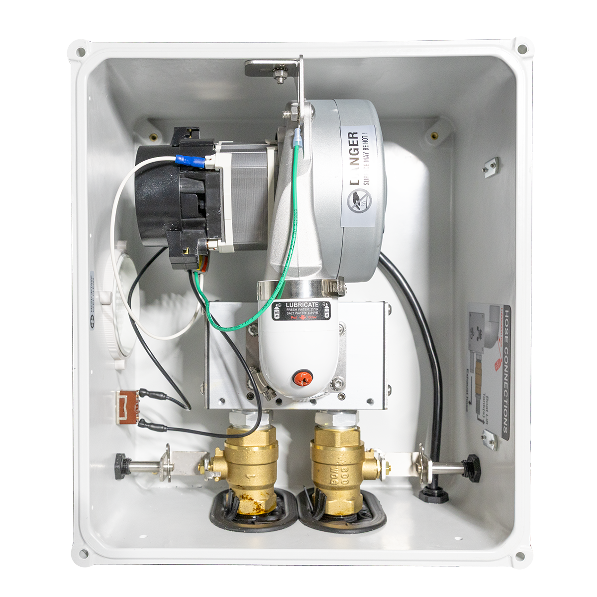 Mechanical system with valves and wiring inside a white enclosure