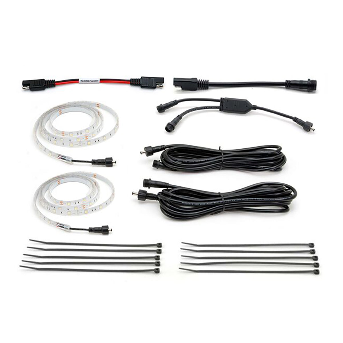 Set of LED strip lights and connectors on a white background