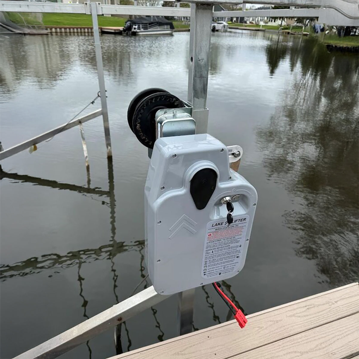 DCR boat lift motor mounted on a lift on a lake