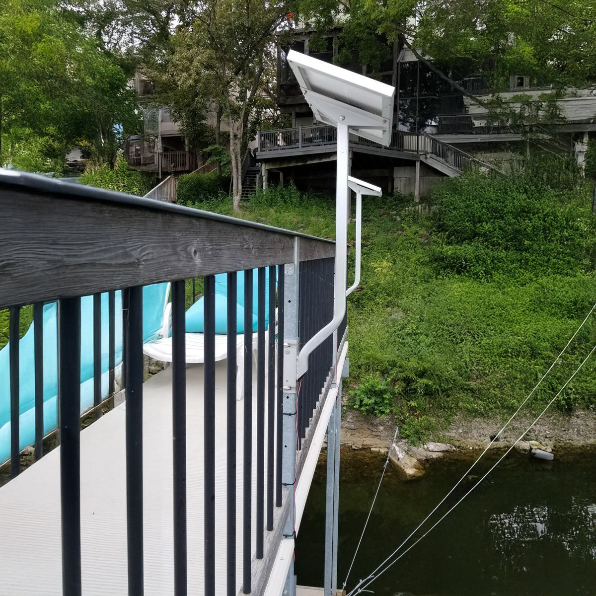 Solar panel mounting arm and bracket