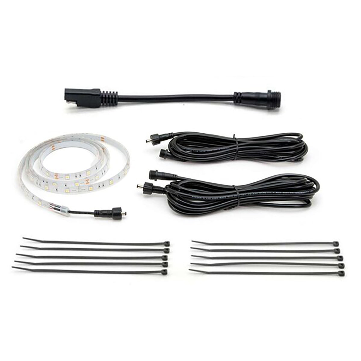 Set of LED strip lights, connectors, and cables on a white background